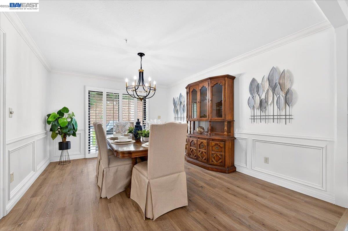 28 Harrington Road Moraga, CA 94556 - Photo 15 of 44 a dining room with furniture wooden floor a potted plant and wooden floor