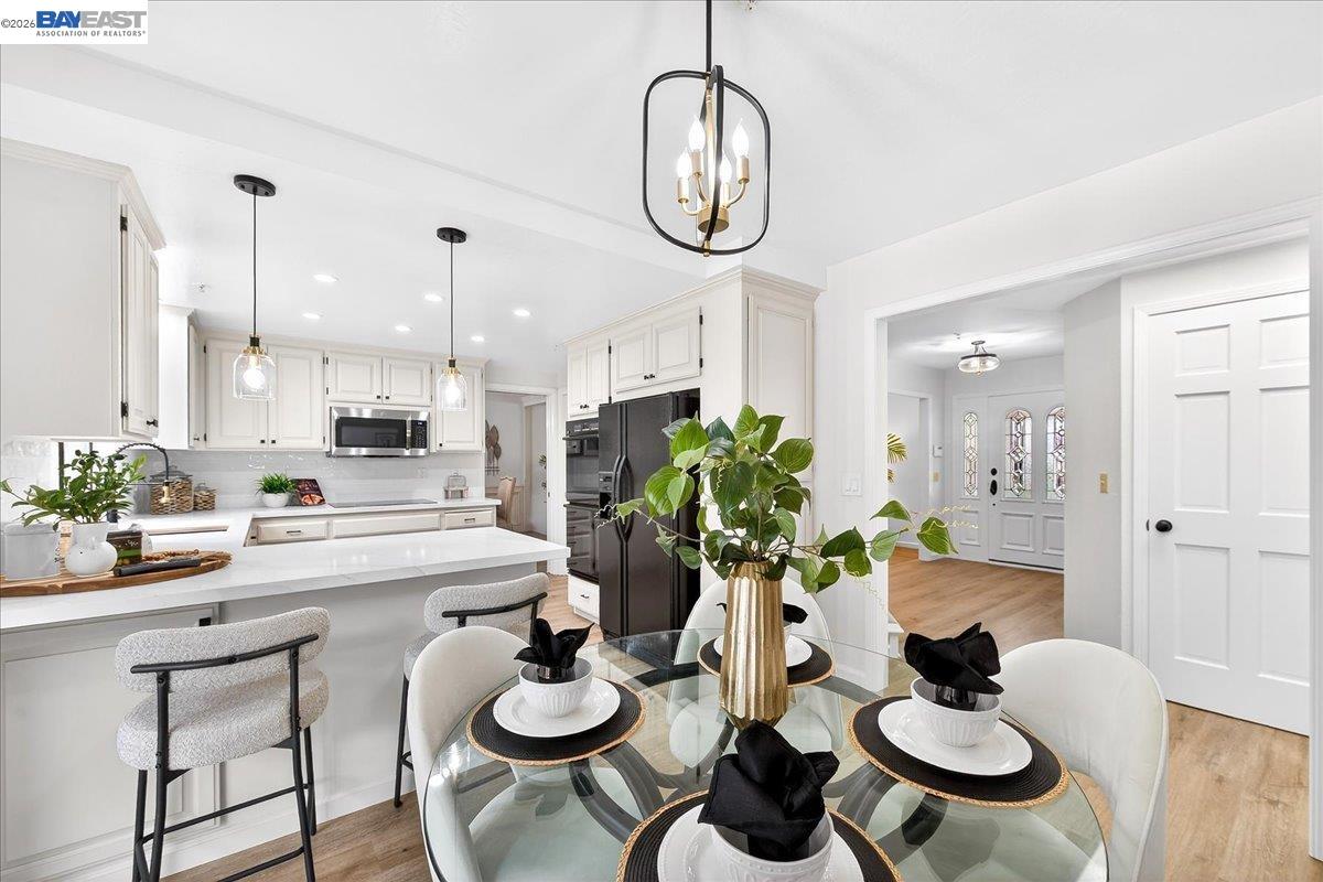 28 Harrington Road Moraga, CA 94556 - Photo 18 of 44 a kitchen with a dining table and chairs