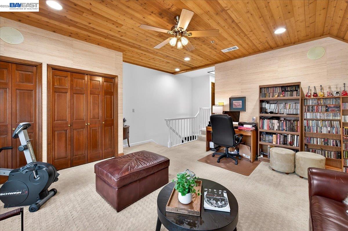 28 Harrington Road Moraga, CA 94556 - Photo 28 of 44 a living room with furniture and a chandelier