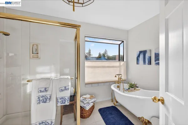 a bath room with a table and a window