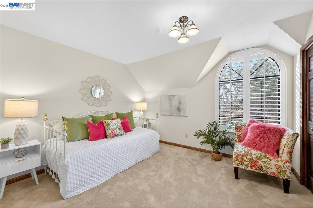 28 Harrington Road Moraga, CA 94556 - Photo 35 of 44 a living room with furniture chandelier and a window
