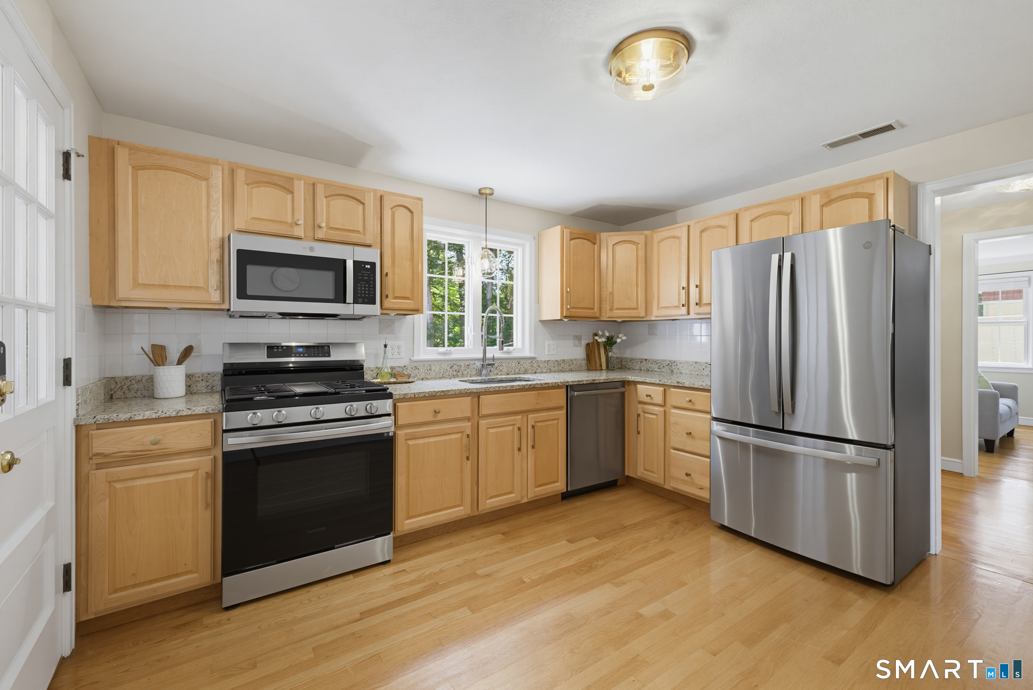 224 Spring Street Manchester, CT 06040 - Photo 7 of 39 a kitchen with a refrigerator stove and microwave