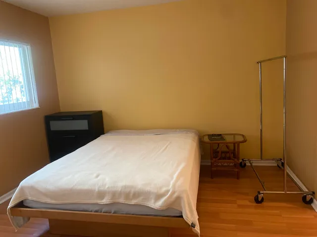 a bedroom with a bed and a table in it