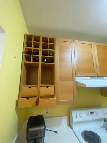 a view of storage and utility room with a window