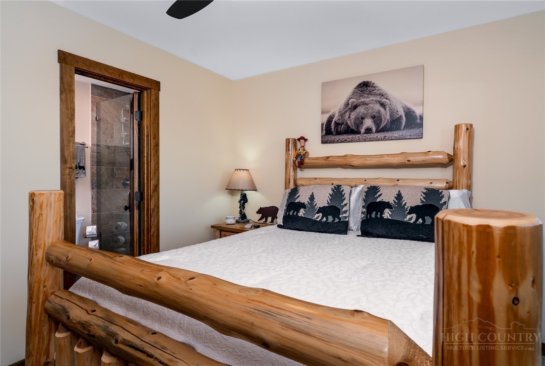 1161 Grandview Dr Extension Boone, NC 28607 - Photo 30 of 43 a bed room with a bed and a painting on the wall
