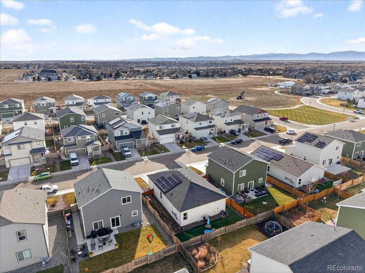 7227 Vermillion Street Frederick, CO 80530 - Photo 24 of 28 an aerial view of a city with lots of residential buildings and ocean view