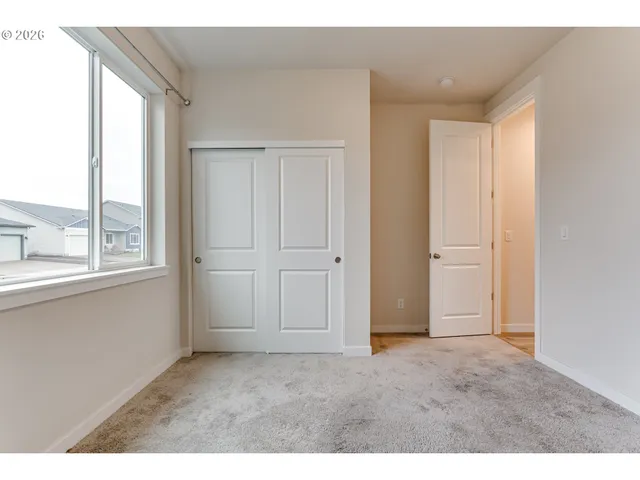 a view of an empty room and window