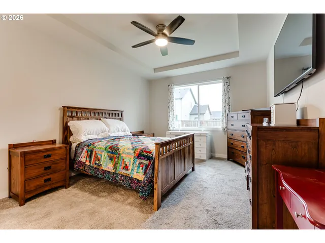 a bed room with a bed and a television