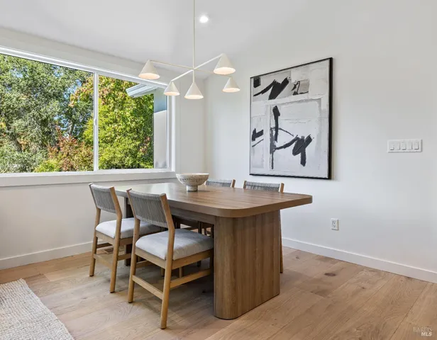 a bathroom with a granite countertop sink a shower and a mirror