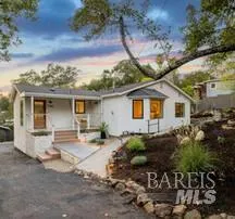 a view of a house with backyard