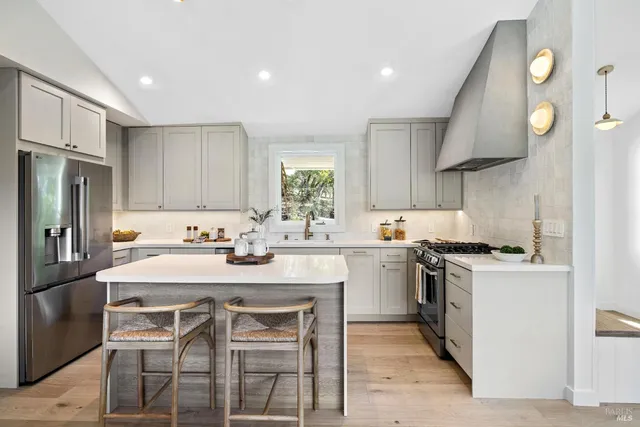 a bedroom with two beds and a window