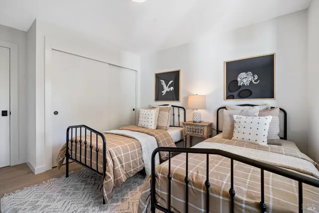 a view of balcony with chairs and potted plants