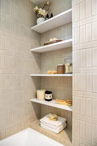 a wooden bench sitting in the middle of a backyard