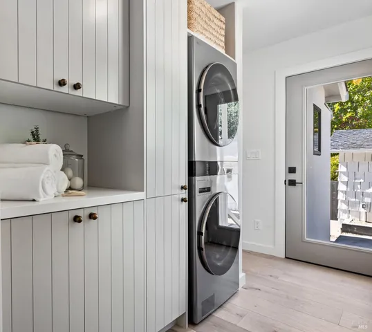 a view of a patio with table and chairs and potted plants