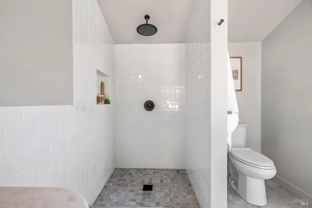 a aerial view of a house with a yard and tree s