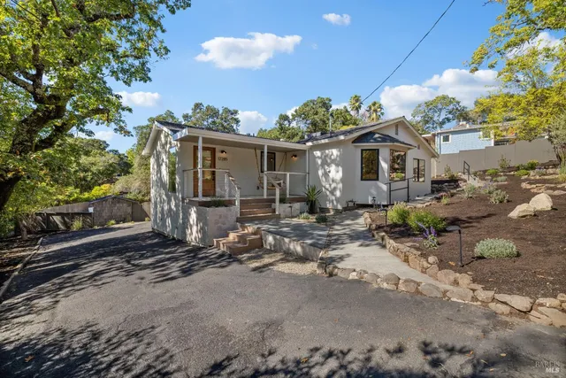 a front view of a house with garden