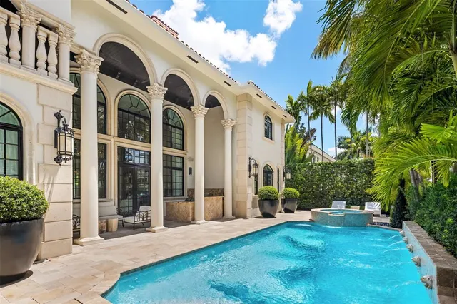 a front view of house with yard outdoor seating and potted plants