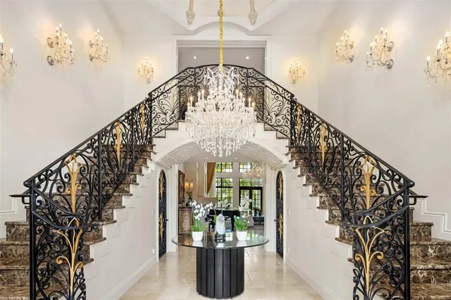 a living room with fireplace furniture and a large window