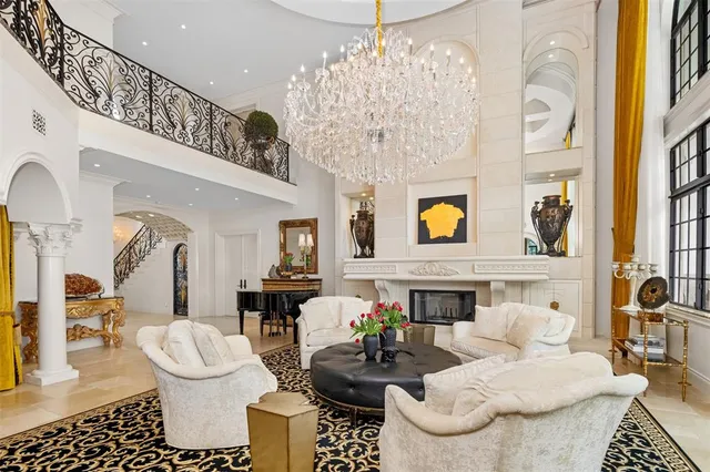 a living room with furniture and a floor to ceiling window