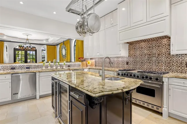 a kitchen with a sink and a refrigerator