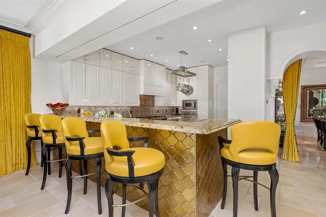 a lobby with furniture and a chandelier