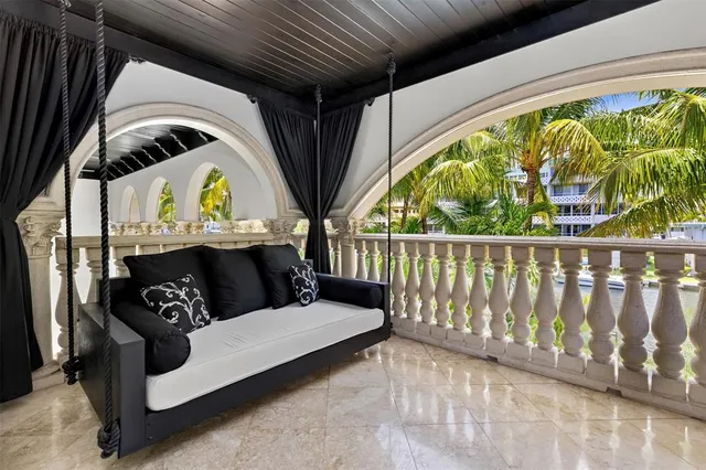 a large kitchen with kitchen island a counter top space a sink stainless steel appliances and cabinets