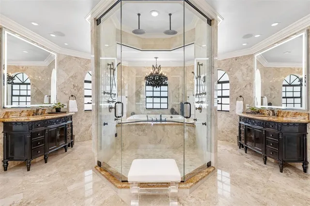 a view of walk in closet with clothes