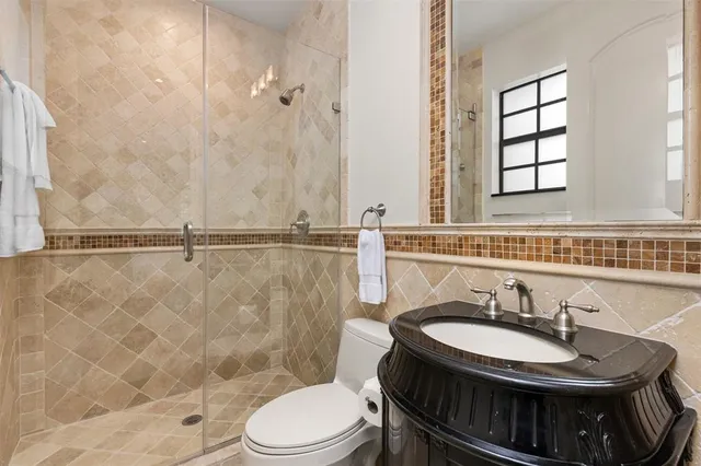 a bedroom with bed and wooden floor