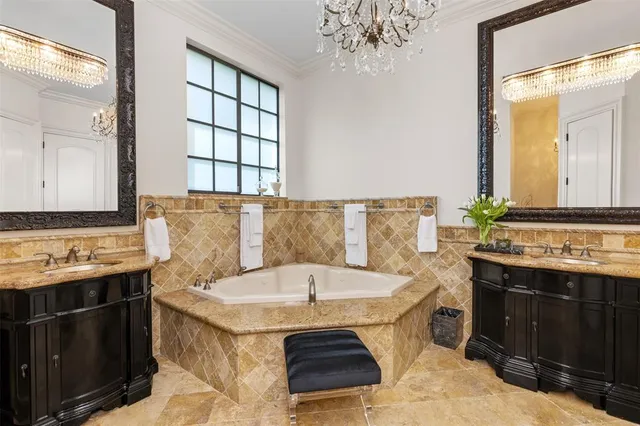 a living room with furniture a flat screen tv and a chandelier