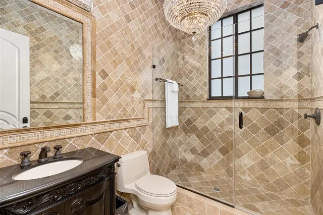 an aerial view of a house with a yard and a sitting area