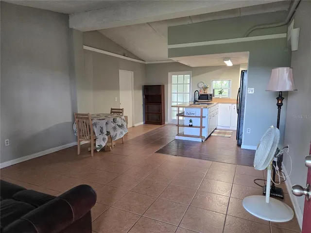 a lobby with furniture and a gym