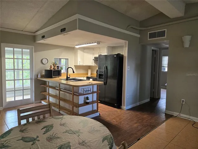 a bedroom with a bed and large window