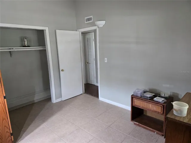 a bathroom with a toilet and a shower curtain