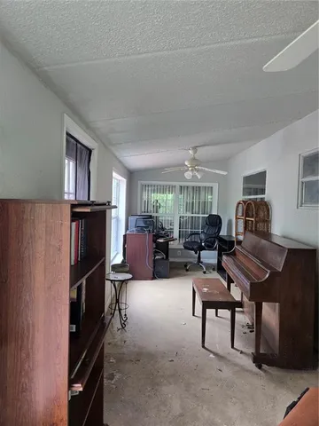 a view of a room that has a large window