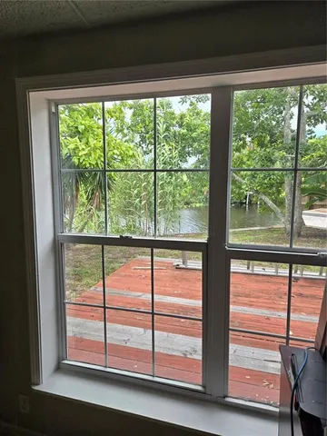 a view of livingroom with furniture and book shelf
