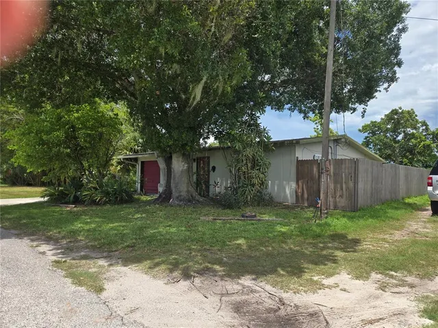a fire hydrant in the middle of a yard