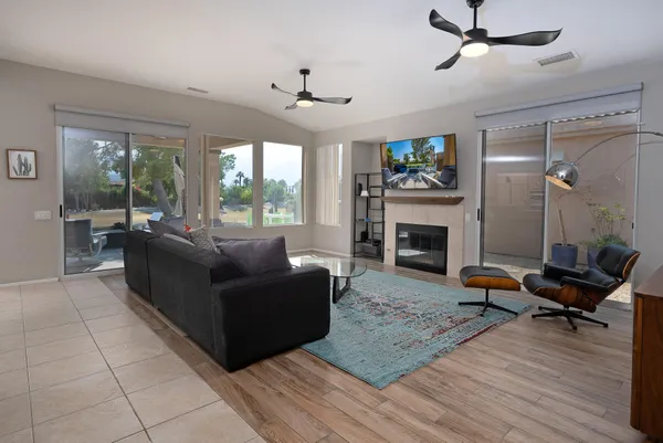 a living room with furniture and a fireplace