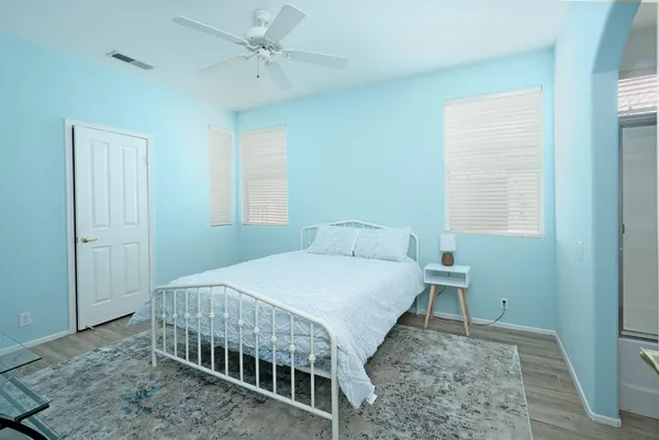 a bedroom with a bed and a table in it