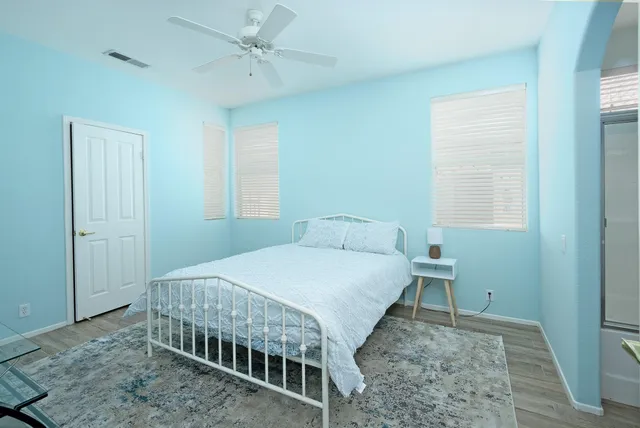 a bedroom with a bed and a table in it