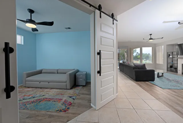 a living room with furniture and a rug