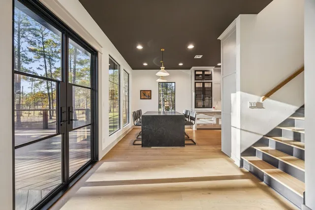 a view of a living room kitchen and a large window