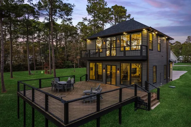 a view of a wooden deck and a yard