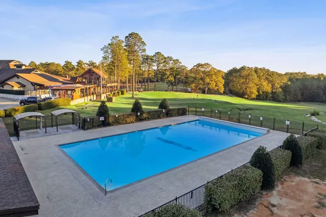 an aerial view of a house with a swimming pool