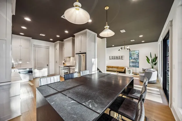 an open kitchen with a table and chairs