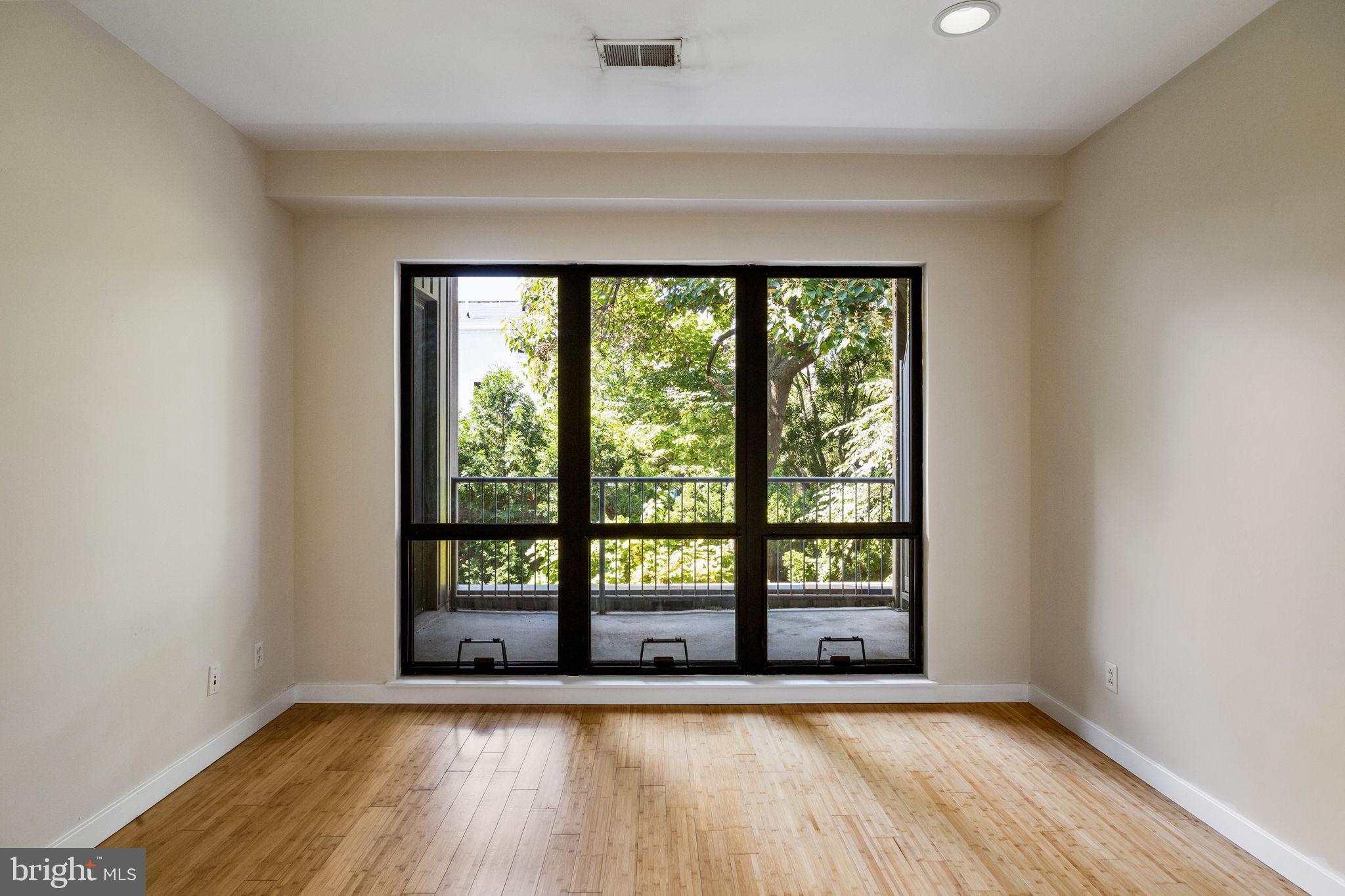 934 North 3rd Street, Unit 205 Philadelphia, PA 19123 - Photo 17 of 39 wooden floor in an empty room with a window