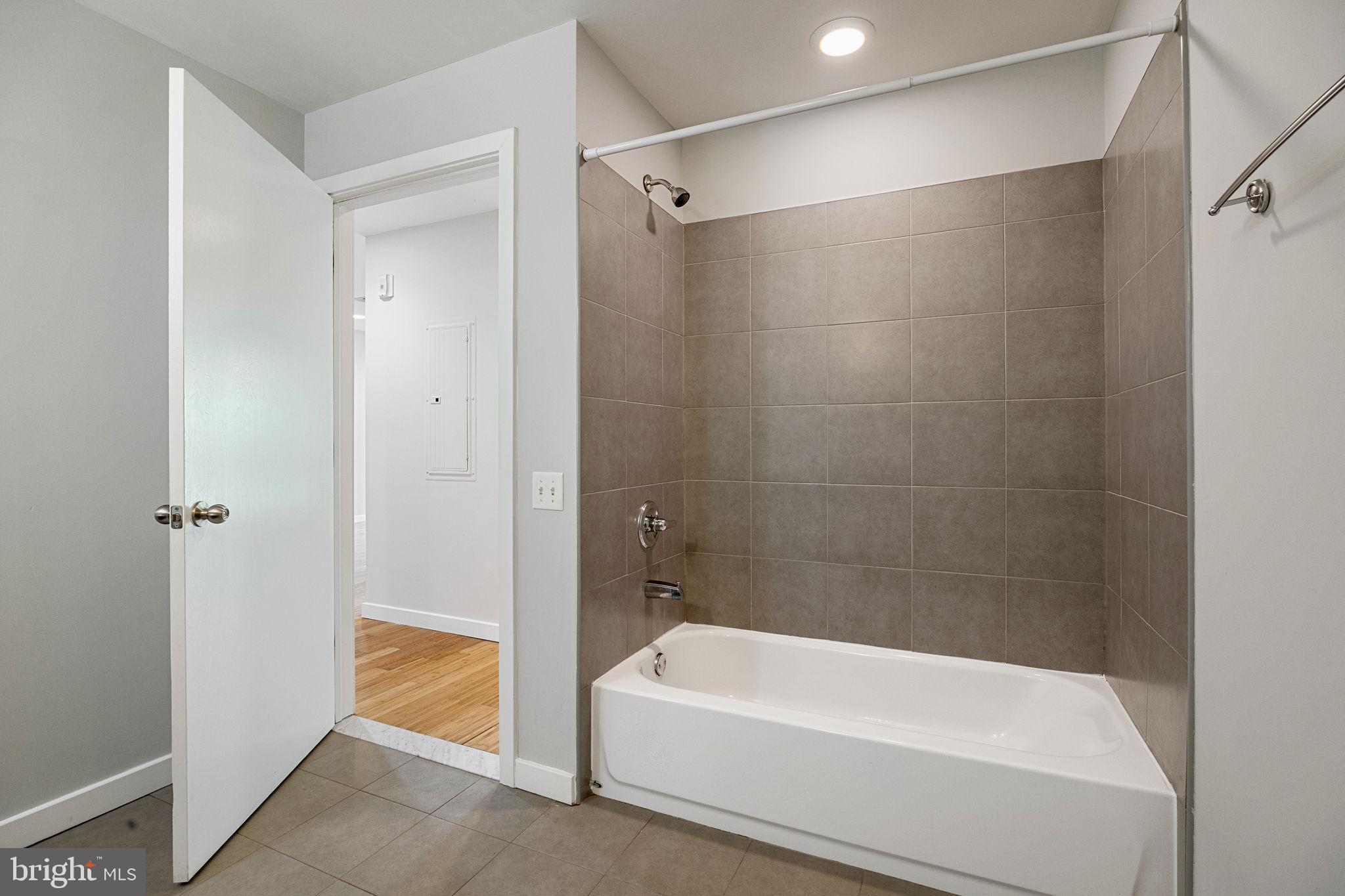 934 North 3rd Street, Unit 205 Philadelphia, PA 19123 - Photo 21 of 39 a bathroom with a bathtub and a shower