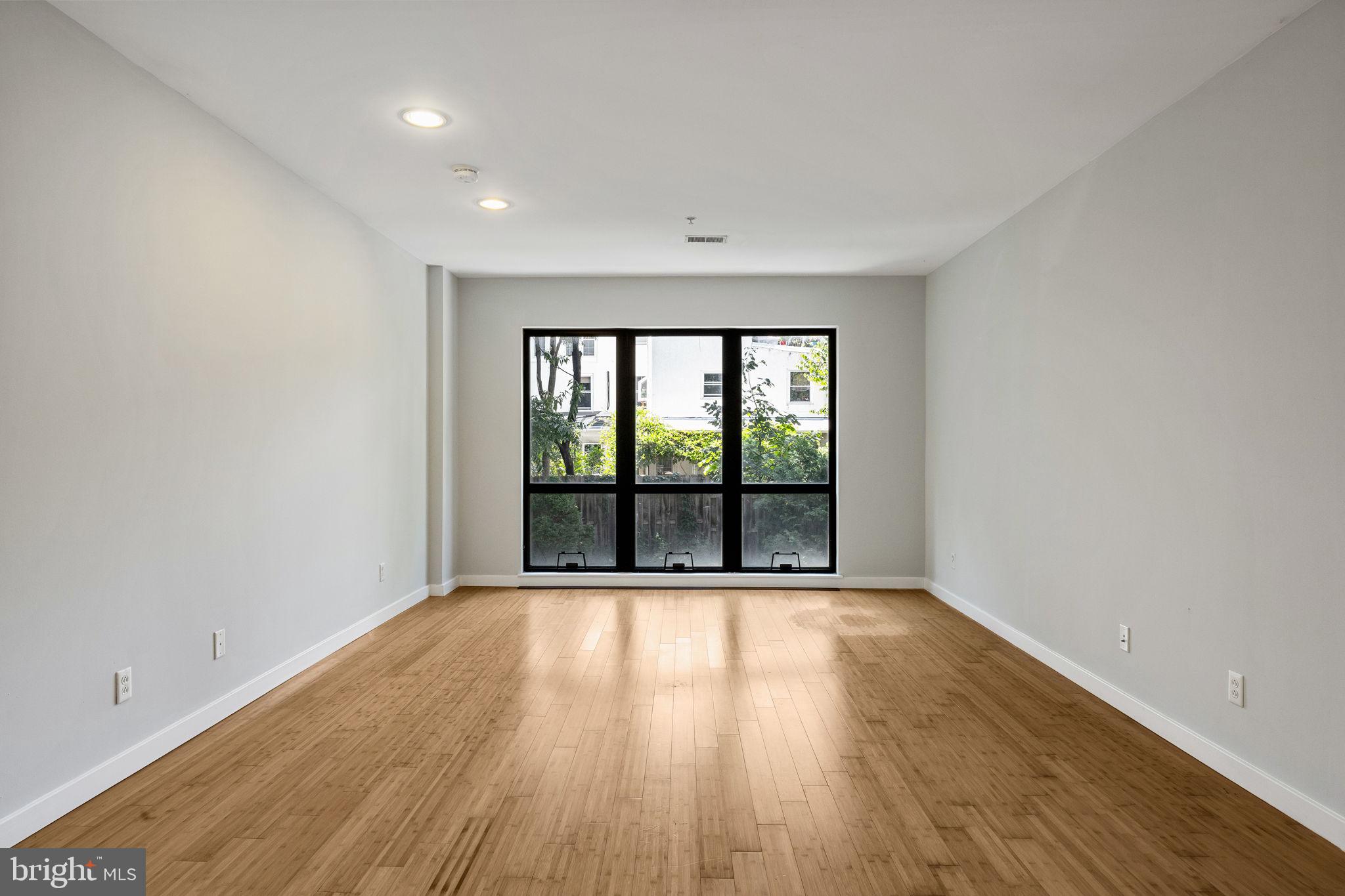 934 North 3rd Street, Unit 205 Philadelphia, PA 19123 - Photo 23 of 39 wooden floor in an empty room with a window