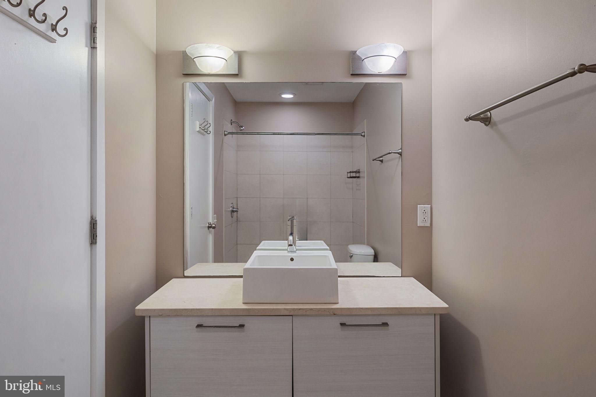 934 North 3rd Street, Unit 205 Philadelphia, PA 19123 - Photo 28 of 39 a bathroom with a sink and a mirror