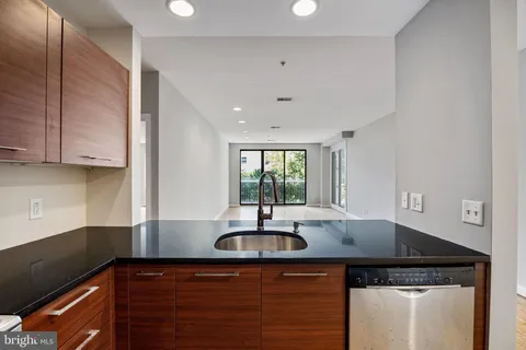 a kitchen with a sink and cabinets