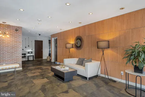 a view of yard with green space and seating area